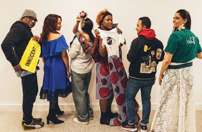 Some project participants expressing themselves through their fashion creations. Photo by JC Candanedo.