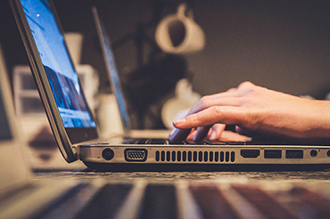 close-up-typing-on-laptop